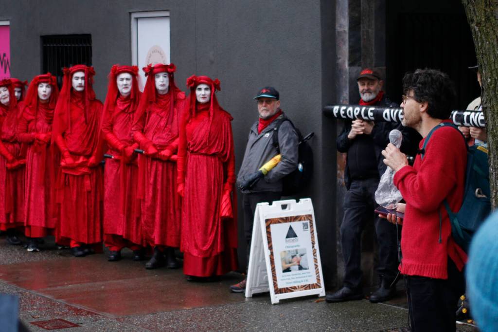 Proposed pipeline draws crimson-draped protesters to Victoria